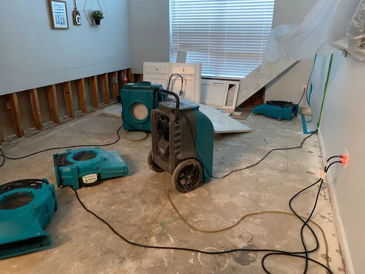 Dehumidifier in flood-cut room for Water Damage Restoration in Onondaga